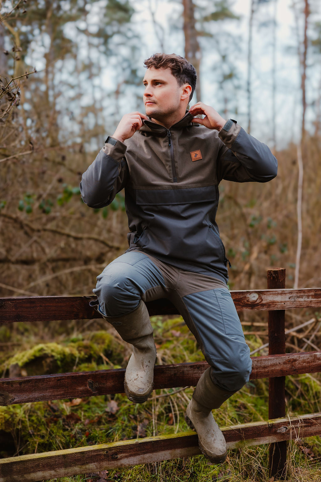 Man in outdoor apparel wearing the Forest Nightjar Smock for adventurous outings