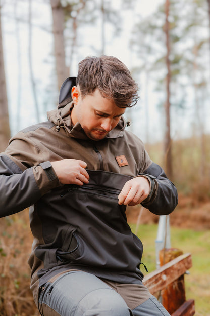 Man wearing a two-tone Forest Nightjar Smock jacket in a stylish outdoor setting