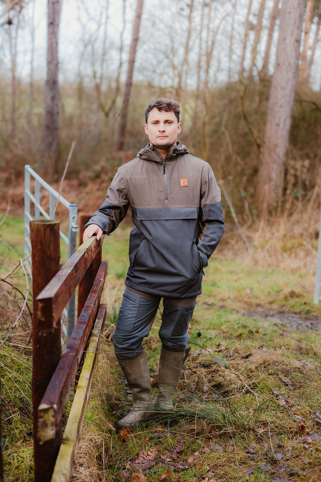 Man in outdoor gear wearing the New Forest Nightjar Smock for stylish adventure