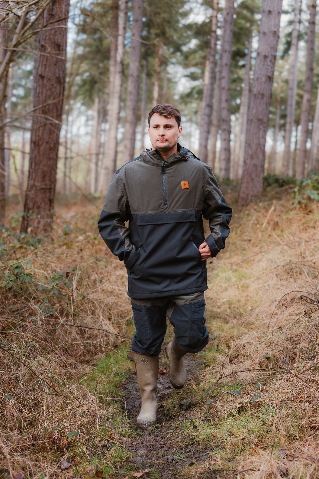 Man in outdoor gear wearing the stylish Forest Nightjar Smock for adventurous outings