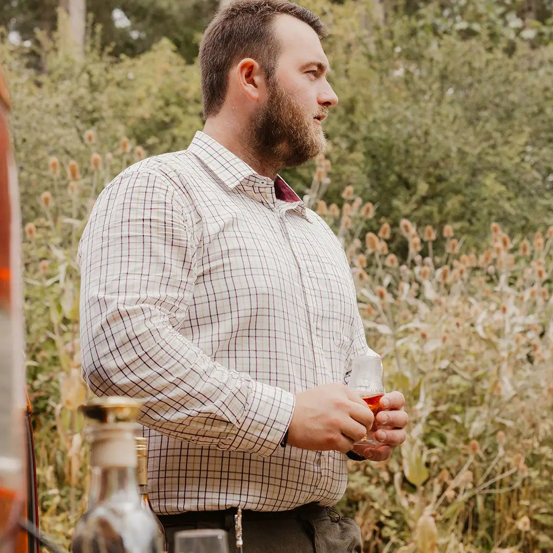 Bearded man in plaid shirt outdoors showcasing Forest Premium Tattersall Shirt