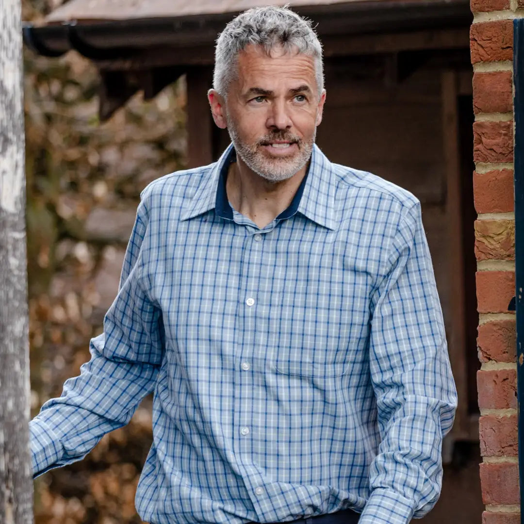 Middle-aged man in a blue checkered premium tattersall shirt from New Forest