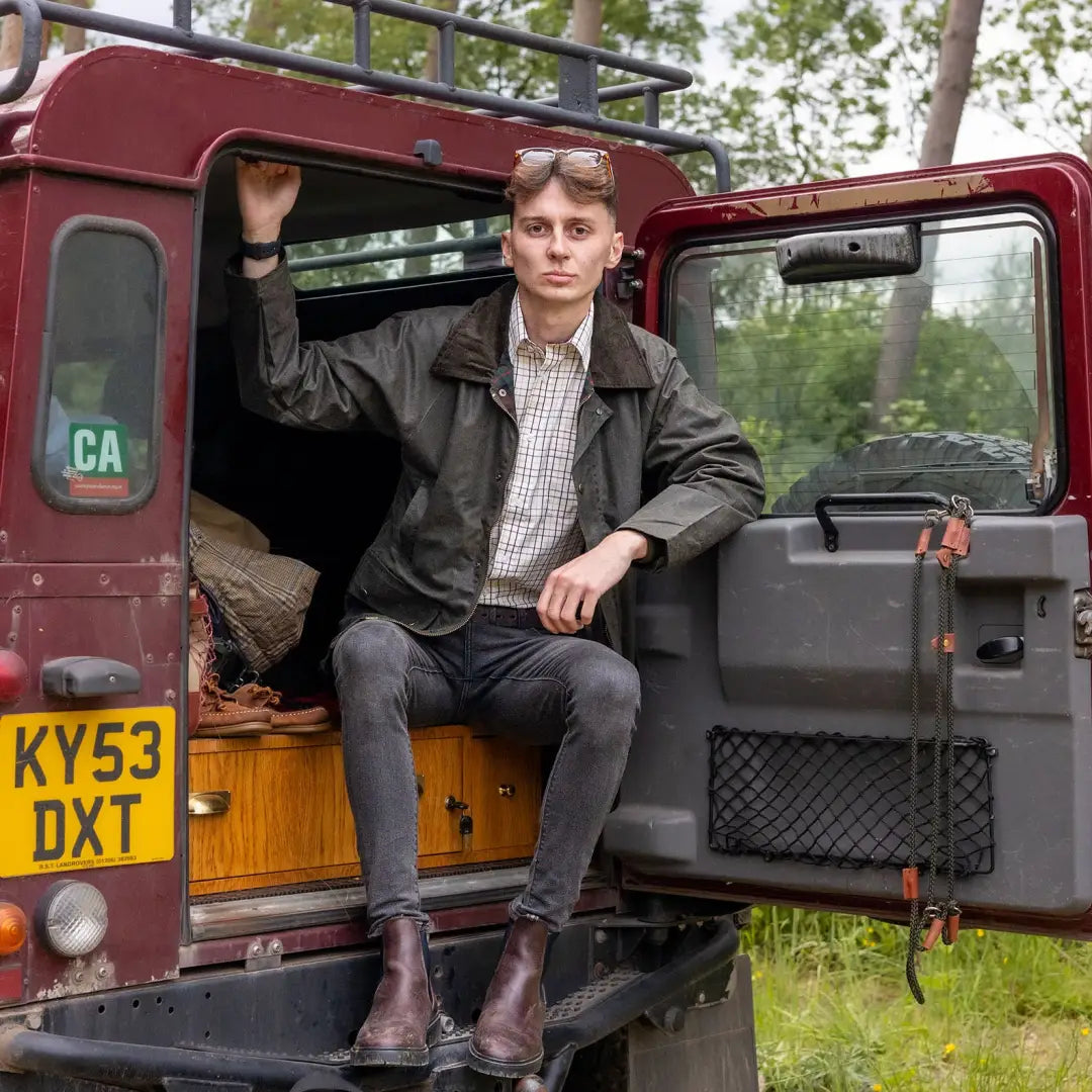 Maroon vintage van with open door and person in doorway, highlighting New Forest Tattersall Shirt