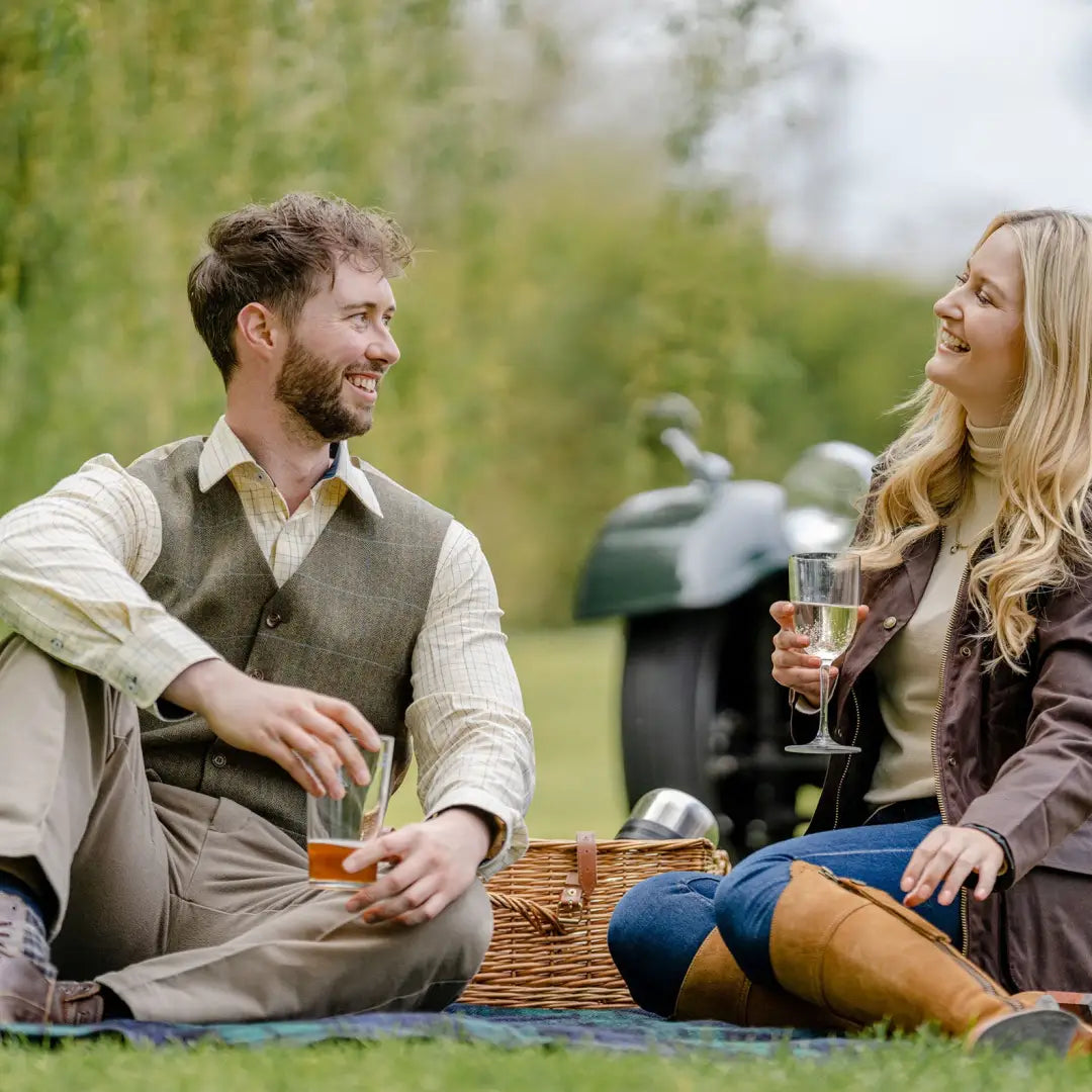 Couple enjoying a picnic in a New Forest Premium Tattersall Shirt made with quality cotton