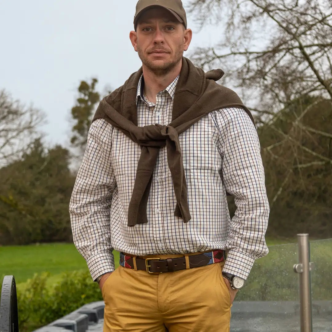 Man in a checked tattersall shirt from New Forest Premium, sporting a cozy sweater