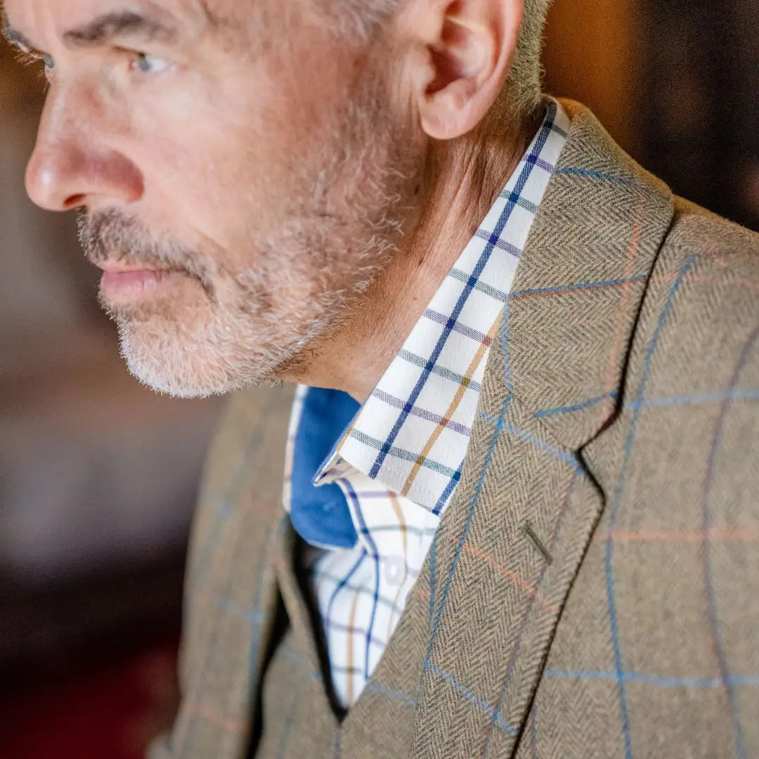 Close-up of a man in a tweed jacket showcasing the New Forest Premium Tattersall Shirt