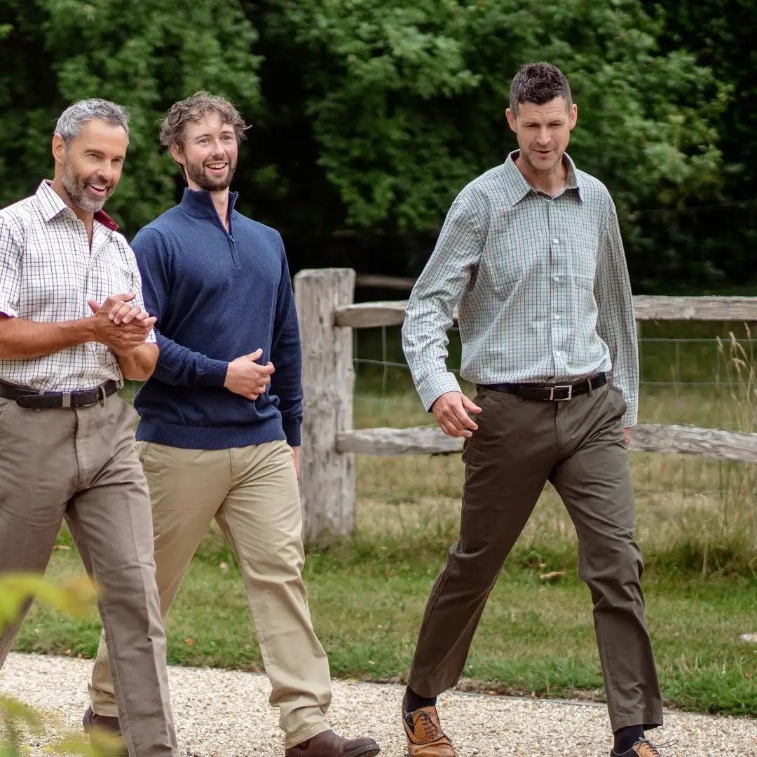 Three men in casual clothes enjoying the outdoors in Forest Premium Tattersall shirts