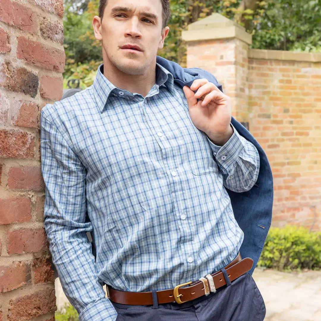 Man in a checkered shirt and navy jacket showcases the New Forest Premium Tattersall Shirt