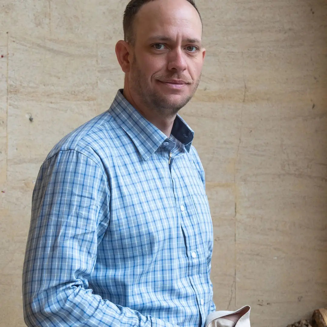 Middle-aged man rocking a blue and white checkered premium tattersall shirt