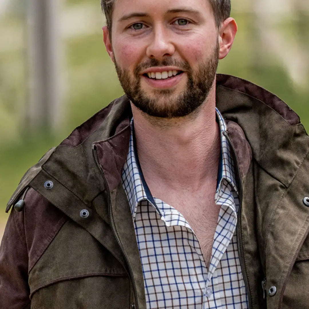 Smiling man in plaid wearing New Forest Premium Tattersall Shirt made of cotton fabric