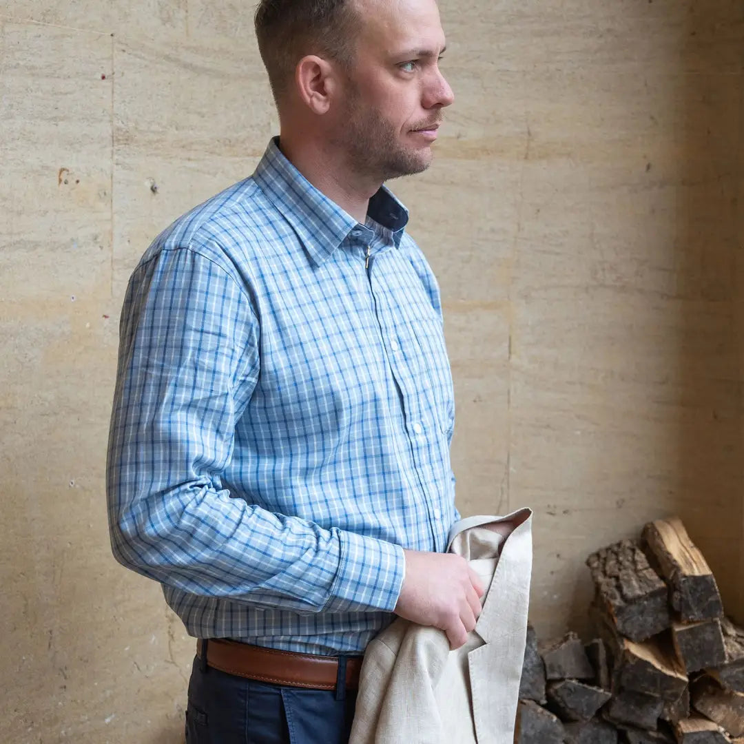 Man wearing a blue plaid premium tattersall shirt for stylish casual looks