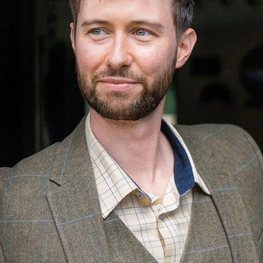 Man in plaid shirt and gray blazer showcasing New Forest Premium Tattersall Shirt made of best quality cotton