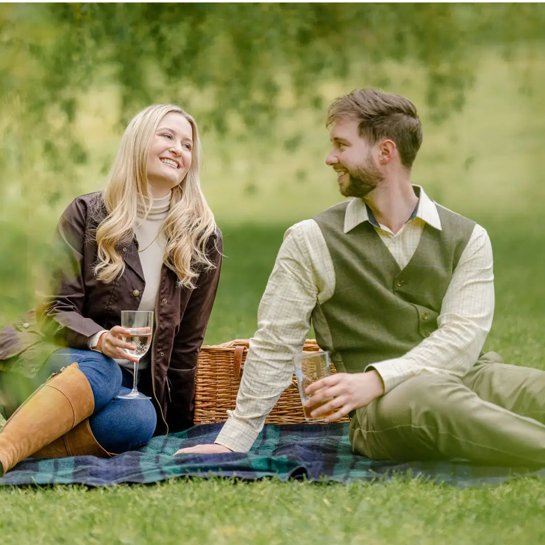 Couple in New Forest Premium Tattersall Shirt enjoying picnic on quality cotton blanket