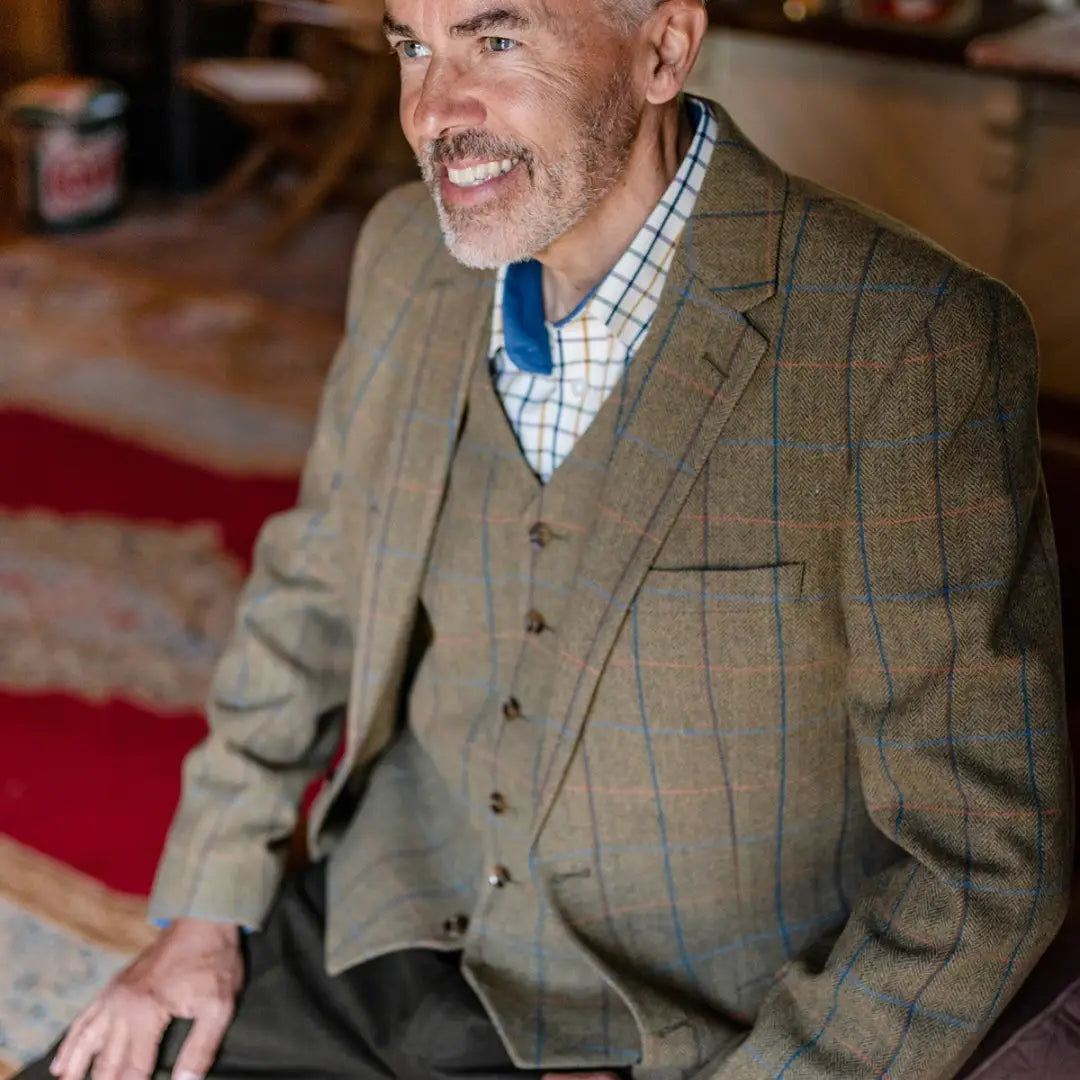 Smiling older man in a New Forest Premium Winchester Tweed Blazer showcasing forest clothing