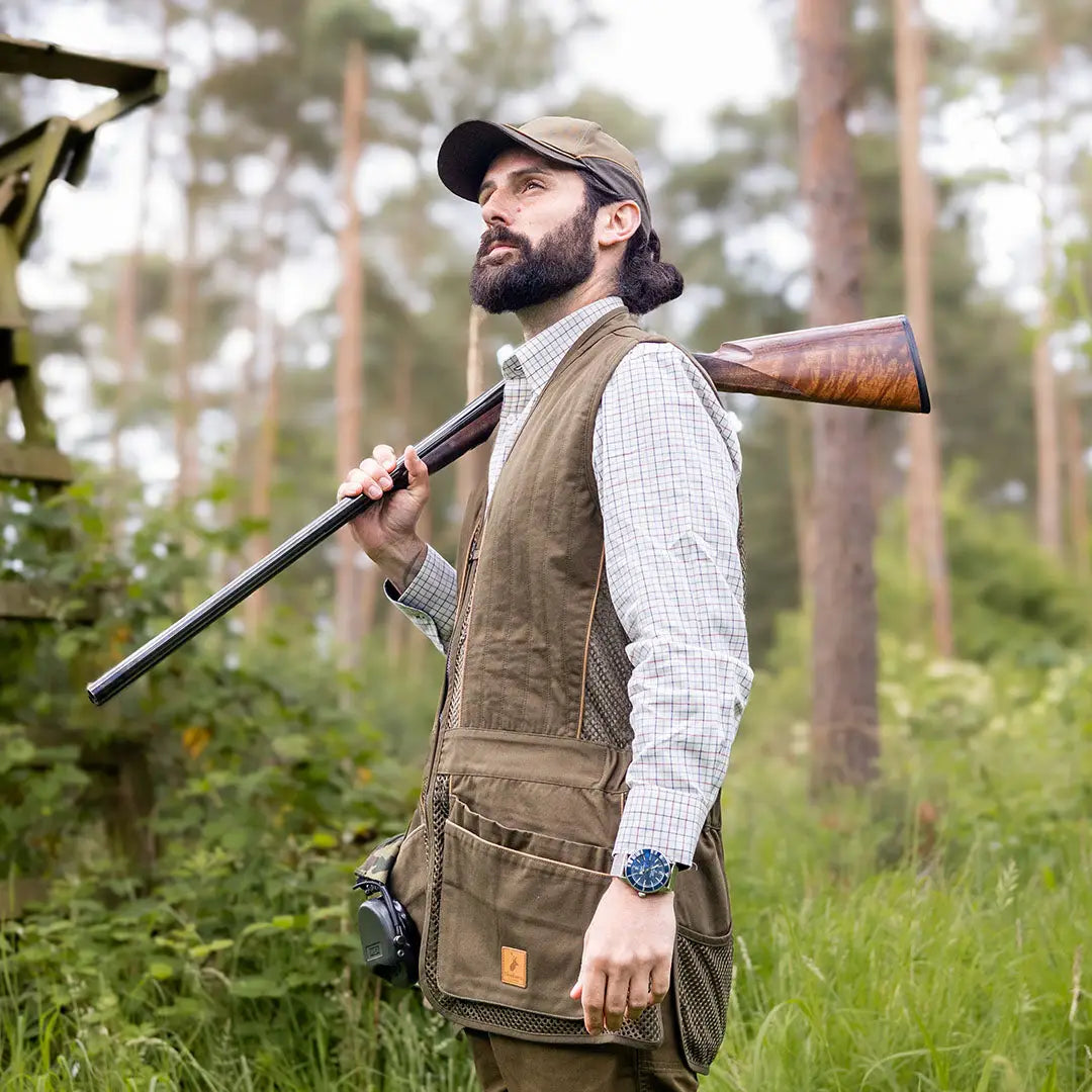 Bearded man in hunting gear with shotgun wearing a New Forest Skeet Vest in poly cotton blend