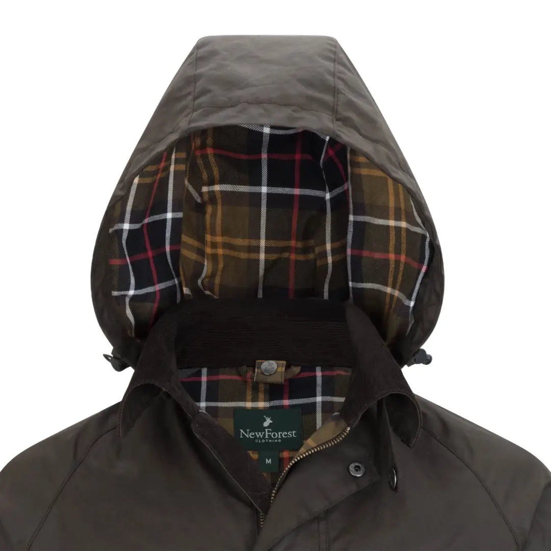 Hooded New Forest Woodsman Wax Jacket showcasing plaid lining in the hood