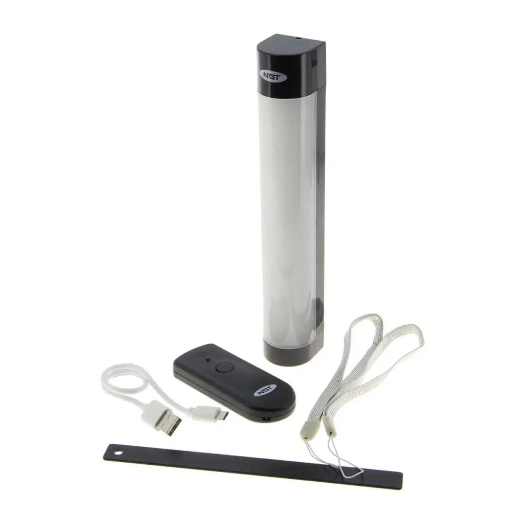 Cylindrical NGT Bivvy Light with black top, remote, and charging cables ready to use