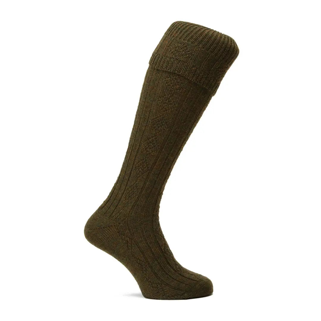 Olive green knee-high Pennine Beater Socks in premium wool with a ribbed pattern