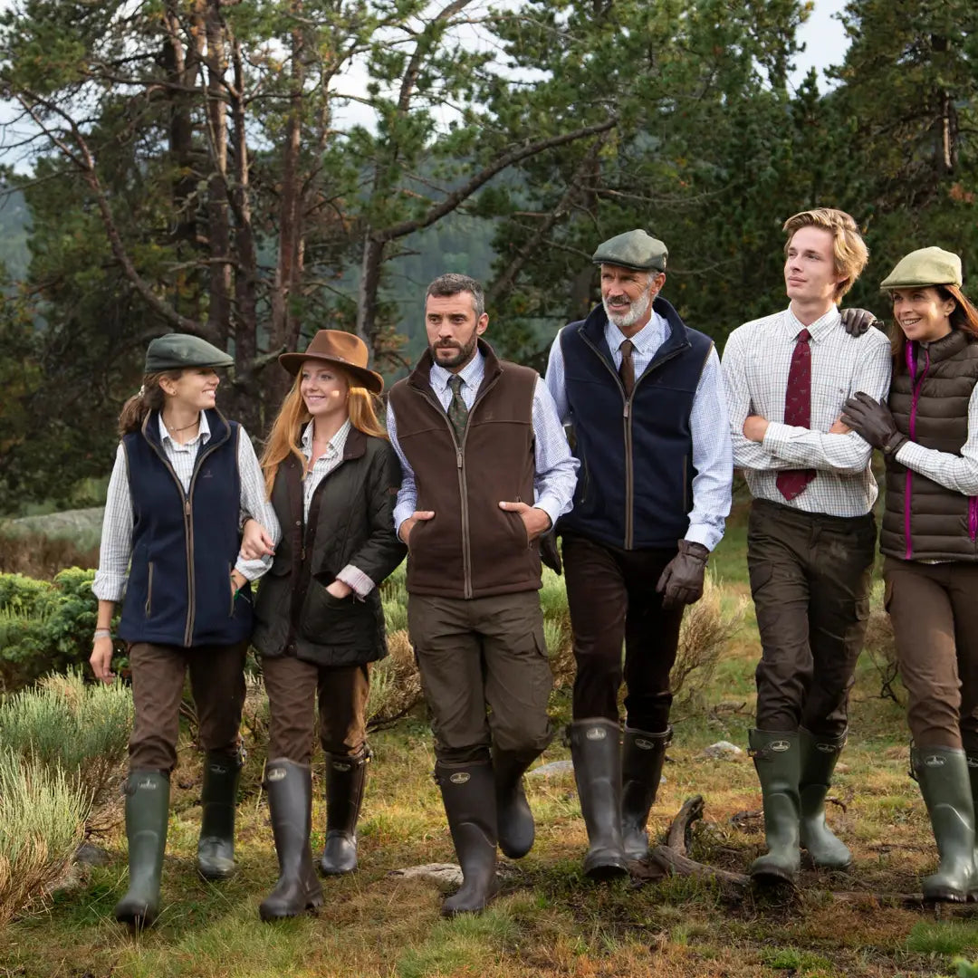 Group of friends in country attire enjoying the outdoors in Percussion Scotland Ladies Fleece Vest