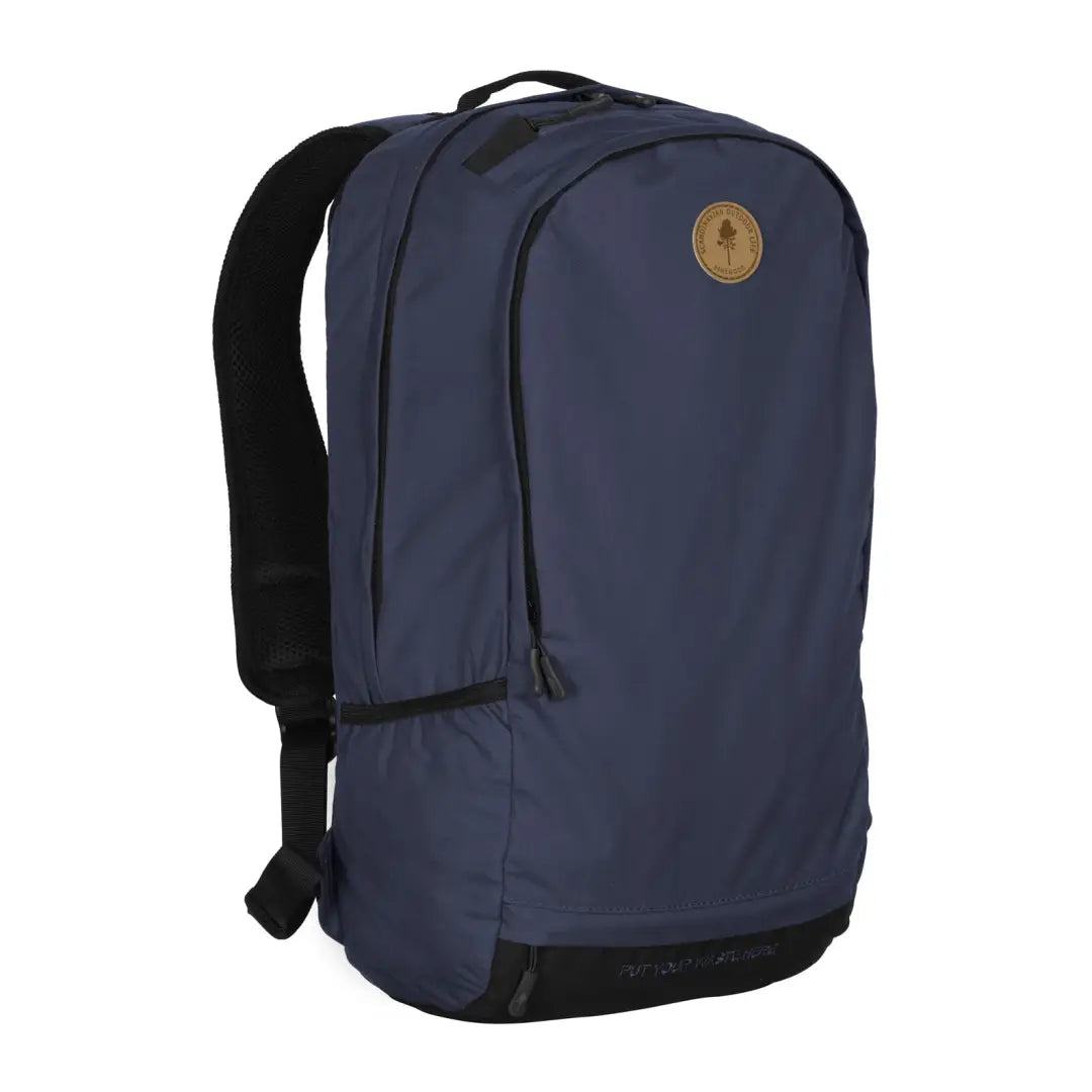 Navy blue Pinewood Day Pack 22L with black straps and circular logo patch