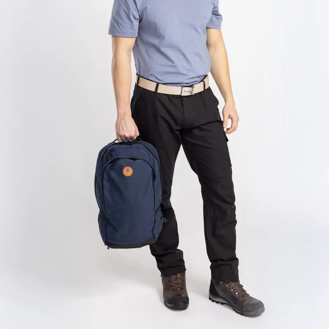 Navy blue Pinewood Day Pack 22L featuring a small circular logo. Perfect for daily adventures