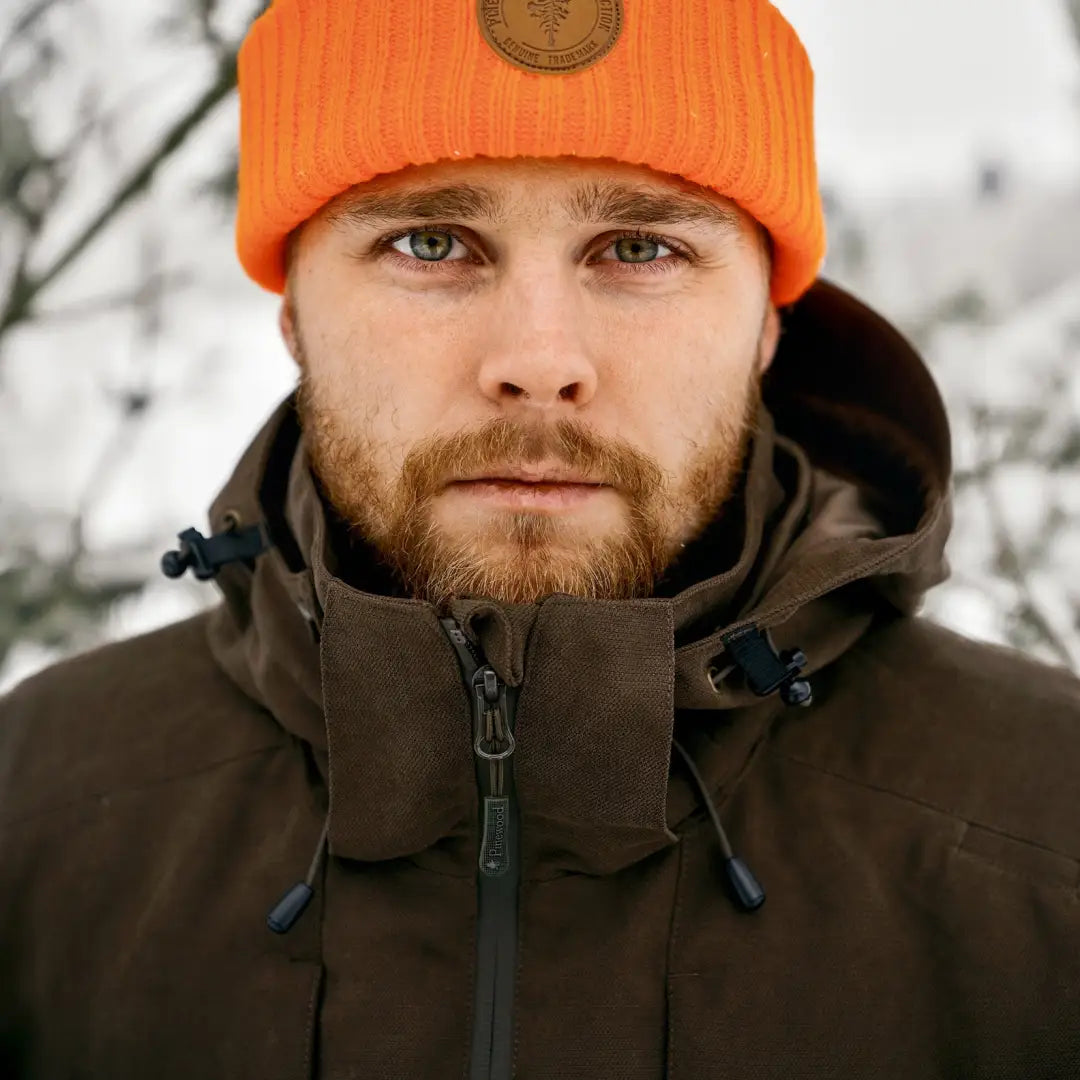 Man in bright orange knit hat with Pinewood Furudal Caribou Hunt Extreme Jacket