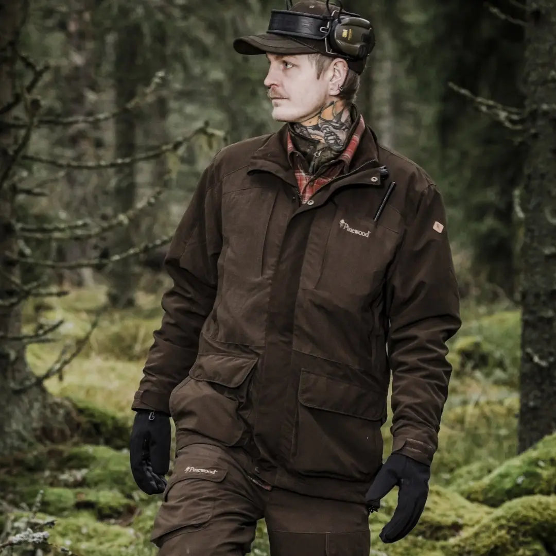 Man in Pinewood Smaland Light Jacket enjoying nature in a forest setting