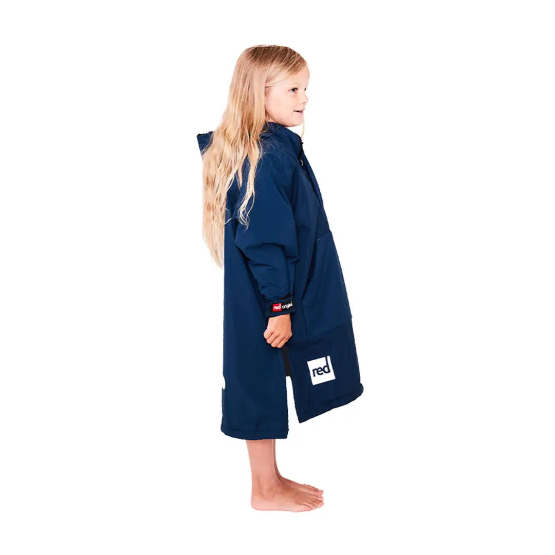 Young child in navy blue towel robe, perfect for a cozy kids dry poncho look