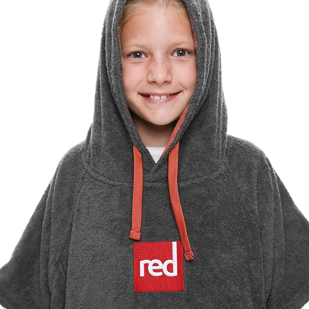 Gray hooded sweatshirt with red logo patch, perfect for kids’ luxury towelling adventures