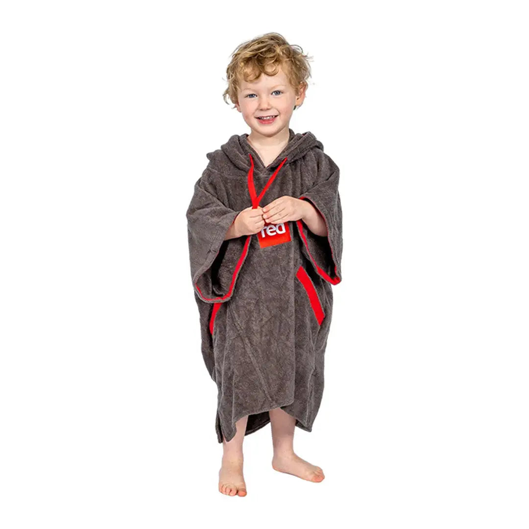 Child in a gray luxury towelling robe with red trim, perfect for cozy country clothing