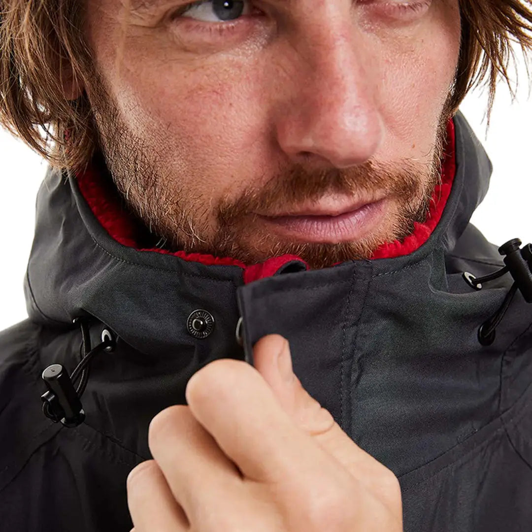 Close-up of a man in a Red Pro Change Long Sleeve Evo Jacket with a hood