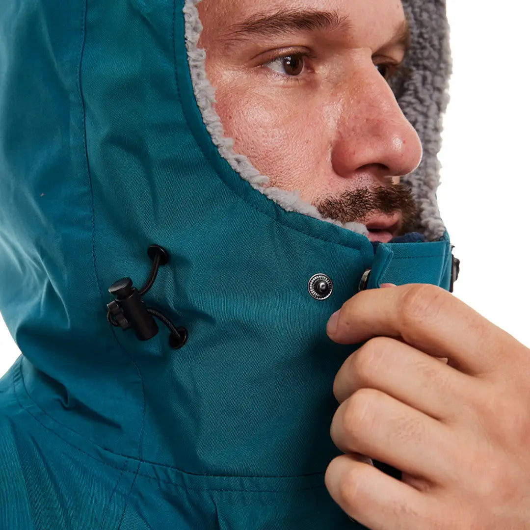 Teal hooded winter jacket showing collar and zipper for Red Pro Change outdoor pros