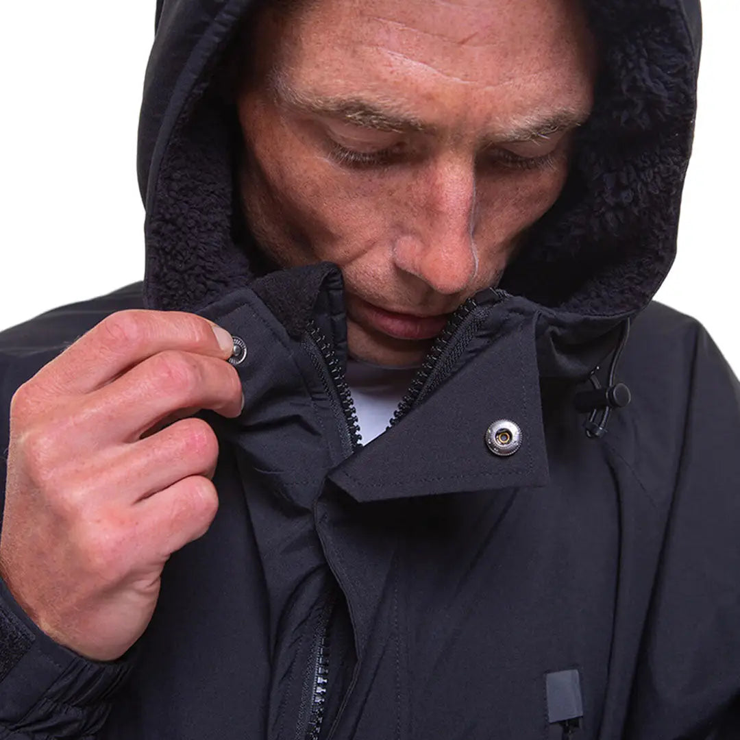 Person adjusting zipper on Dark hooded Red Pro Change Long Sleeve Evo Jacket for easy wear