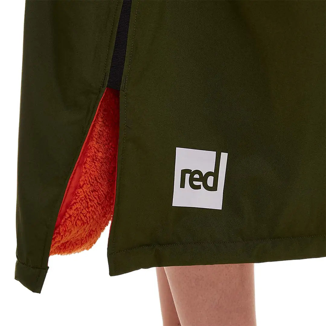 Green dress with red lining and logo patch from Red Pro Change collection