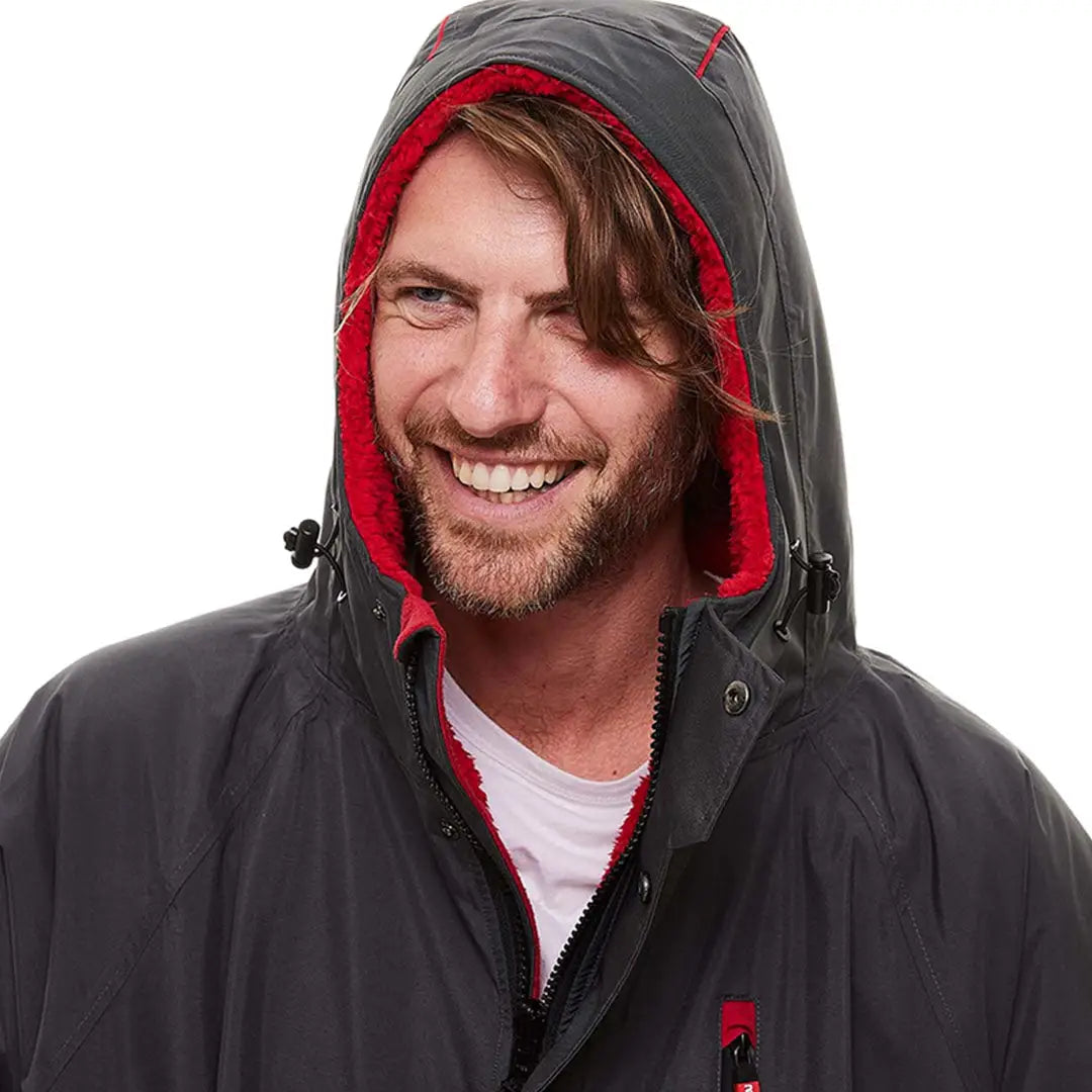 Smiling bearded man in a Red Pro Change Long Sleeve Evo Jacket with a hood