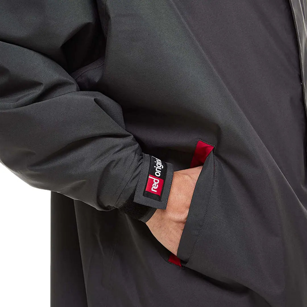 Black Pro Change Long Sleeve Evo Jacket featuring a striking red tag on the sleeve