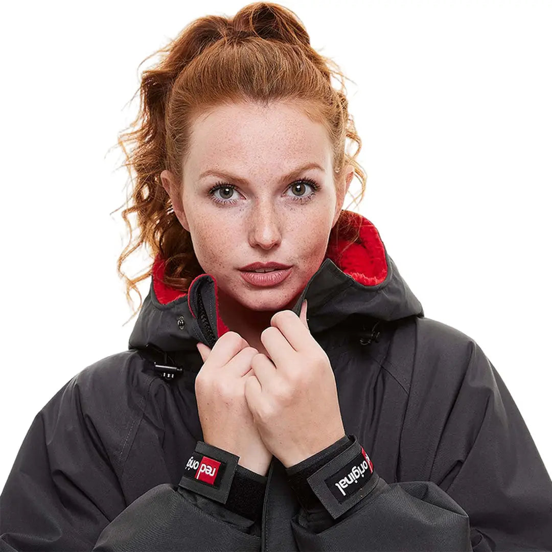 Woman with red hair in a Red Pro Change Long Sleeve Evo Jacket, the ultimate change robe