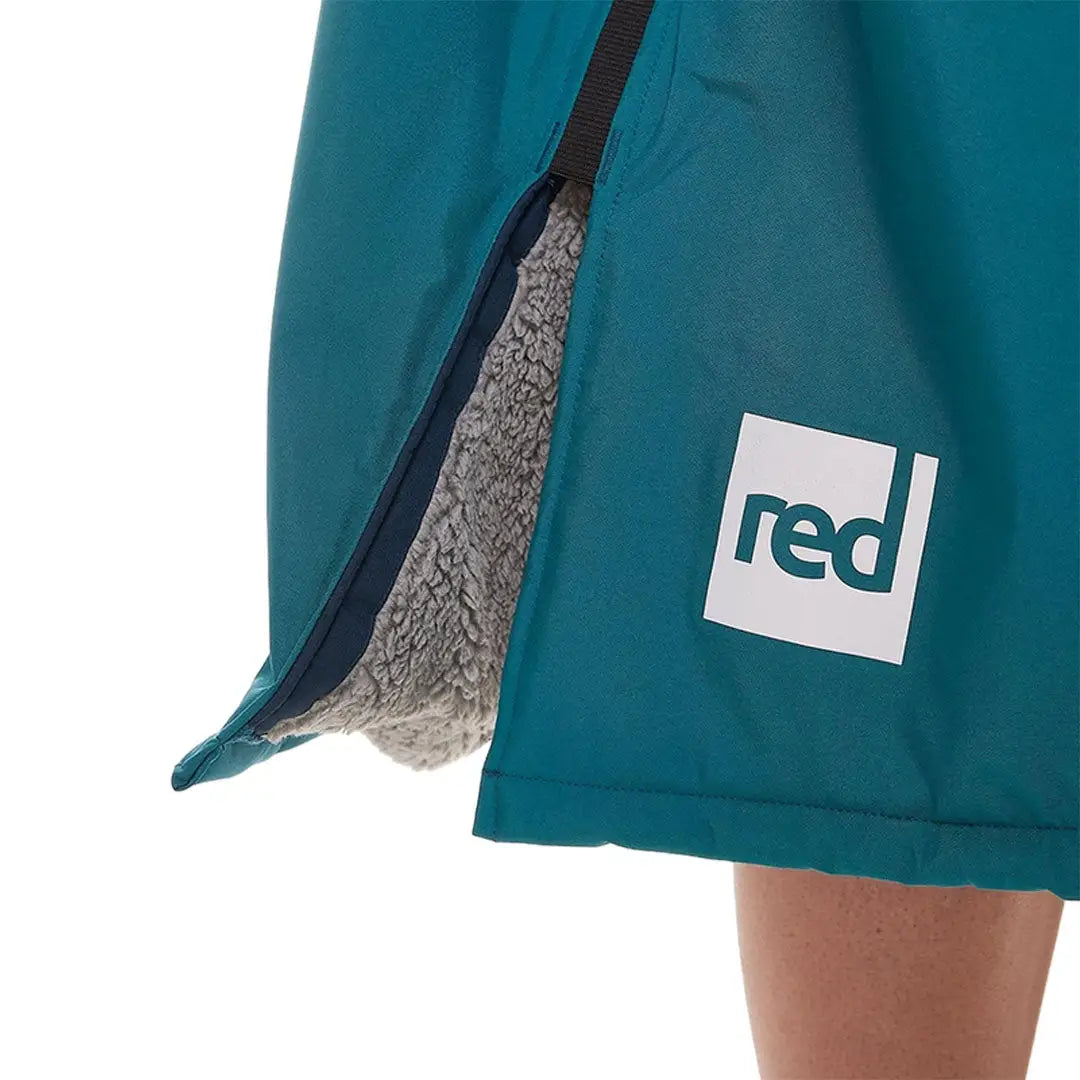 Teal shorts with fleece lining and a white Red logo for the Evo Change Robe