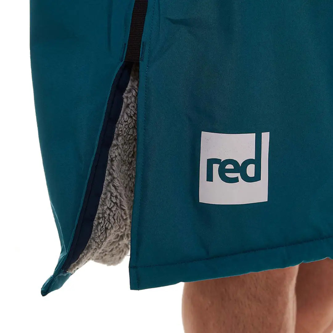 Teal shorts with red logo patch from Red Pro Change, perfect for outdoor professionals