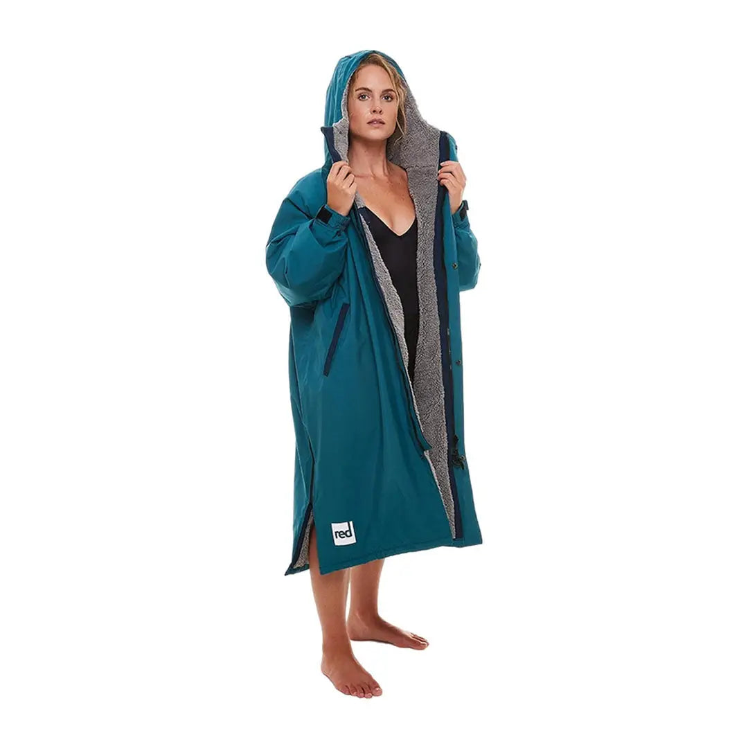 Teal changing robe worn by a person sporting the Red Pro Change Long Sleeve Evo Jacket