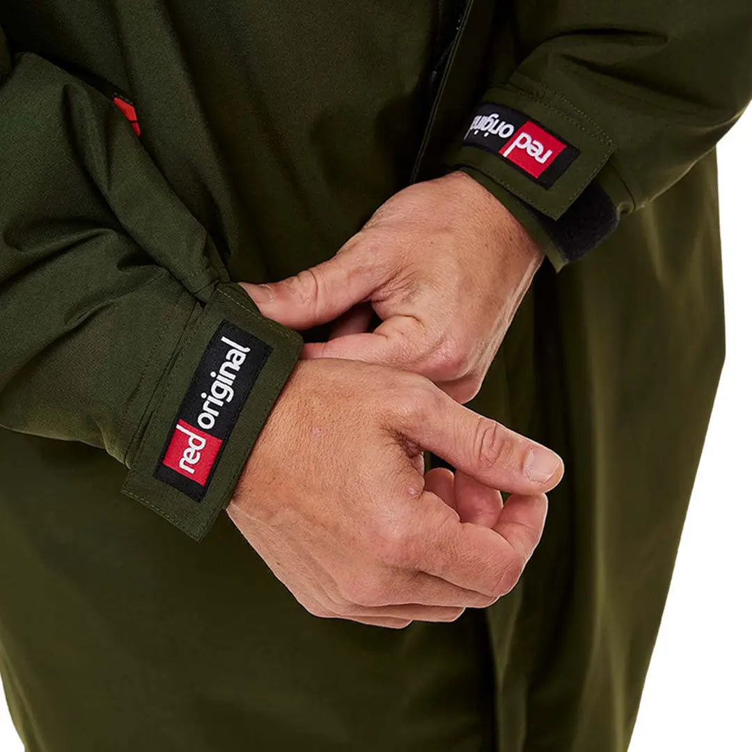 Hands adjusting the sleeve of a Red Pro Change Long Sleeve Evo Jacket