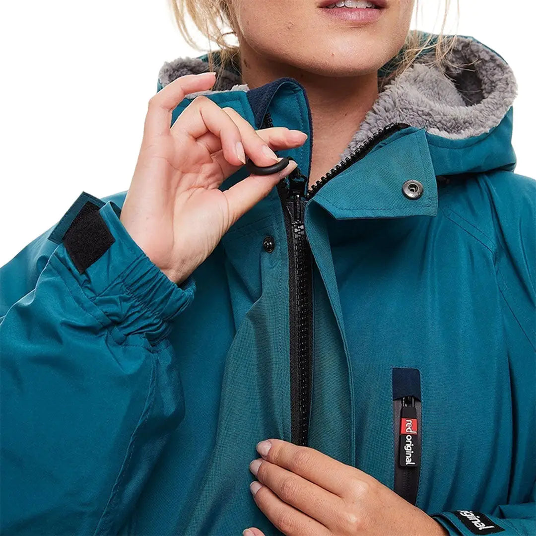 Teal winter jacket with fur-lined hood perfect for Red Pro Change outdoor professionals