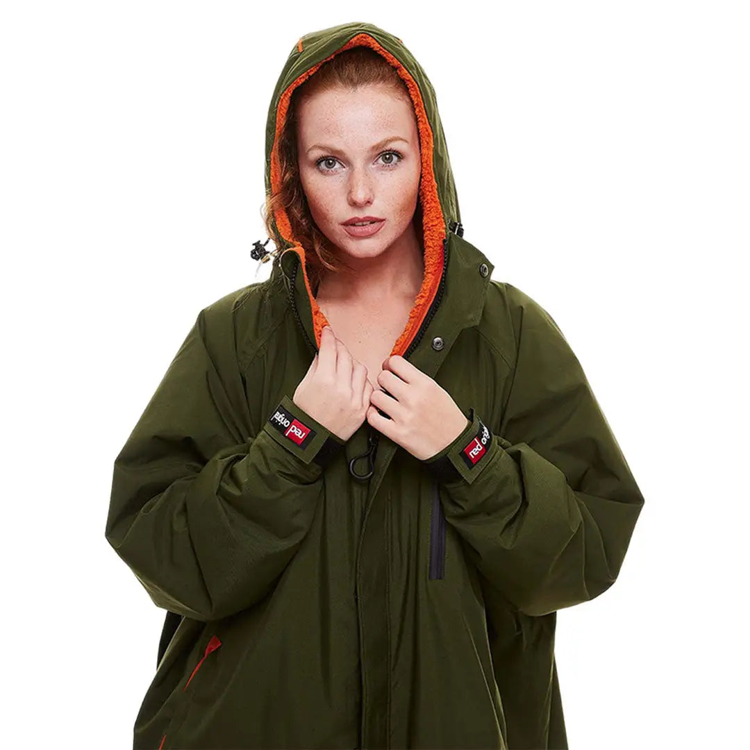 Green winter coat with bright orange-lined hood from Pro Change Long Sleeve Evo Jacket