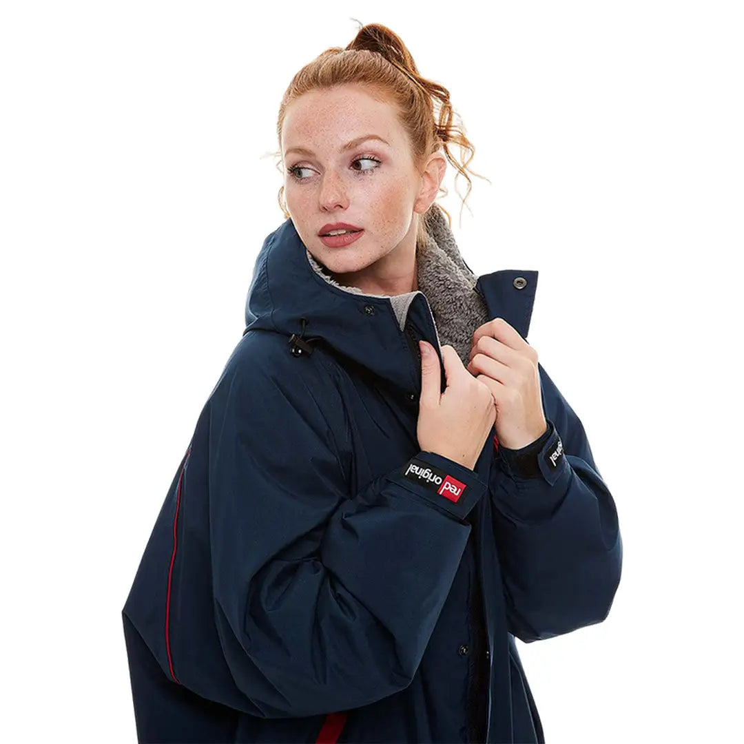 Navy blue winter coat with high collar and red trim, perfect for your Change Robe needs