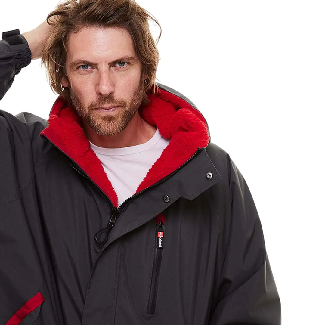 Man in Red Pro Change Long Sleeve Evo Jacket showcasing stylish winter wear