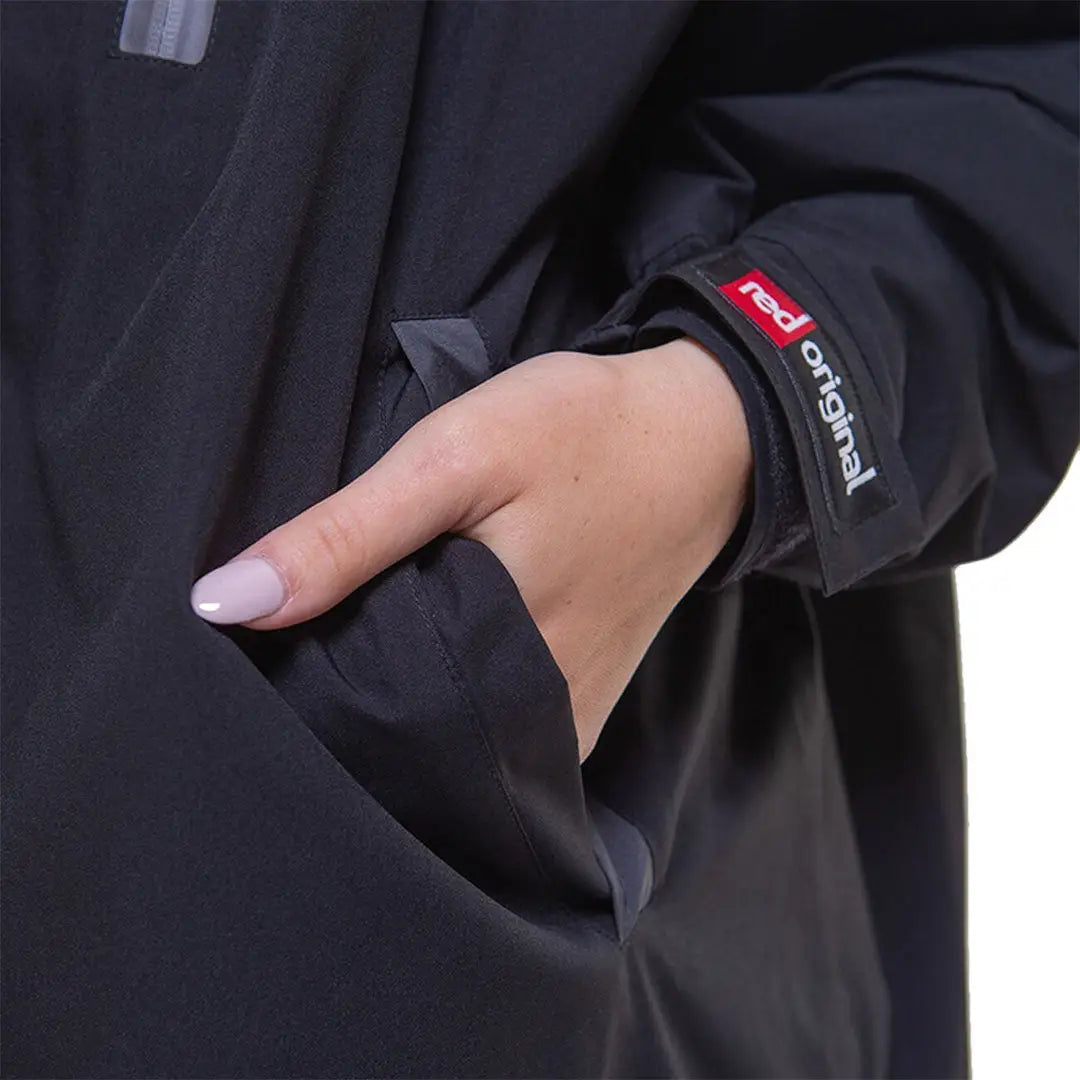 Hand with stylish nails peeking from Black jacket sleeve of Red Pro Change Long Sleeve Evo Jacket