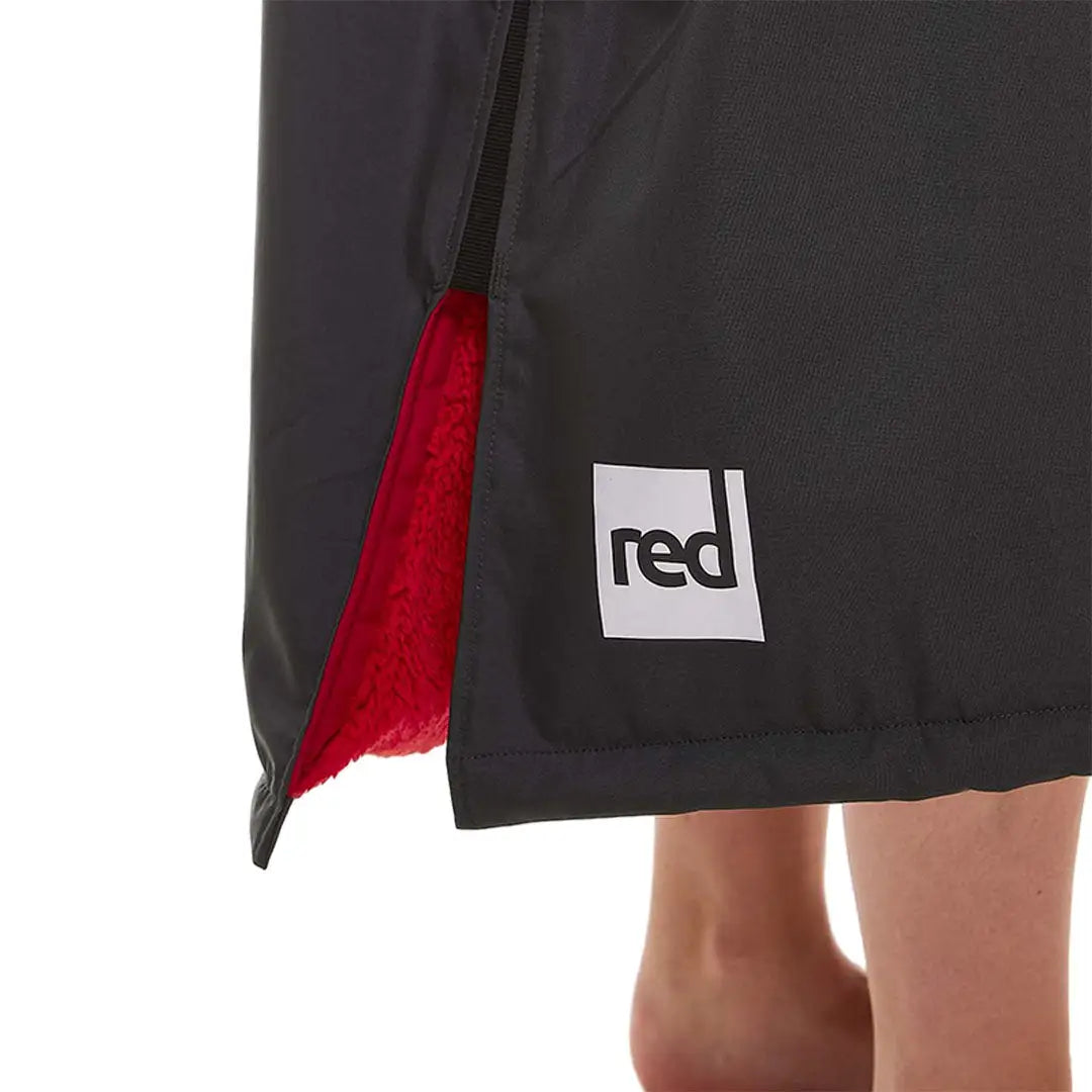 Black shorts or skirt with red accent and logo from Red Pro Change Long Sleeve Evo Jacket