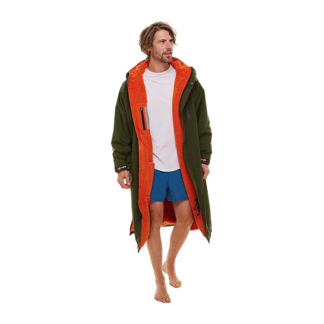 Long green Pro Change jacket with bright orange lining and hood for style and warmth