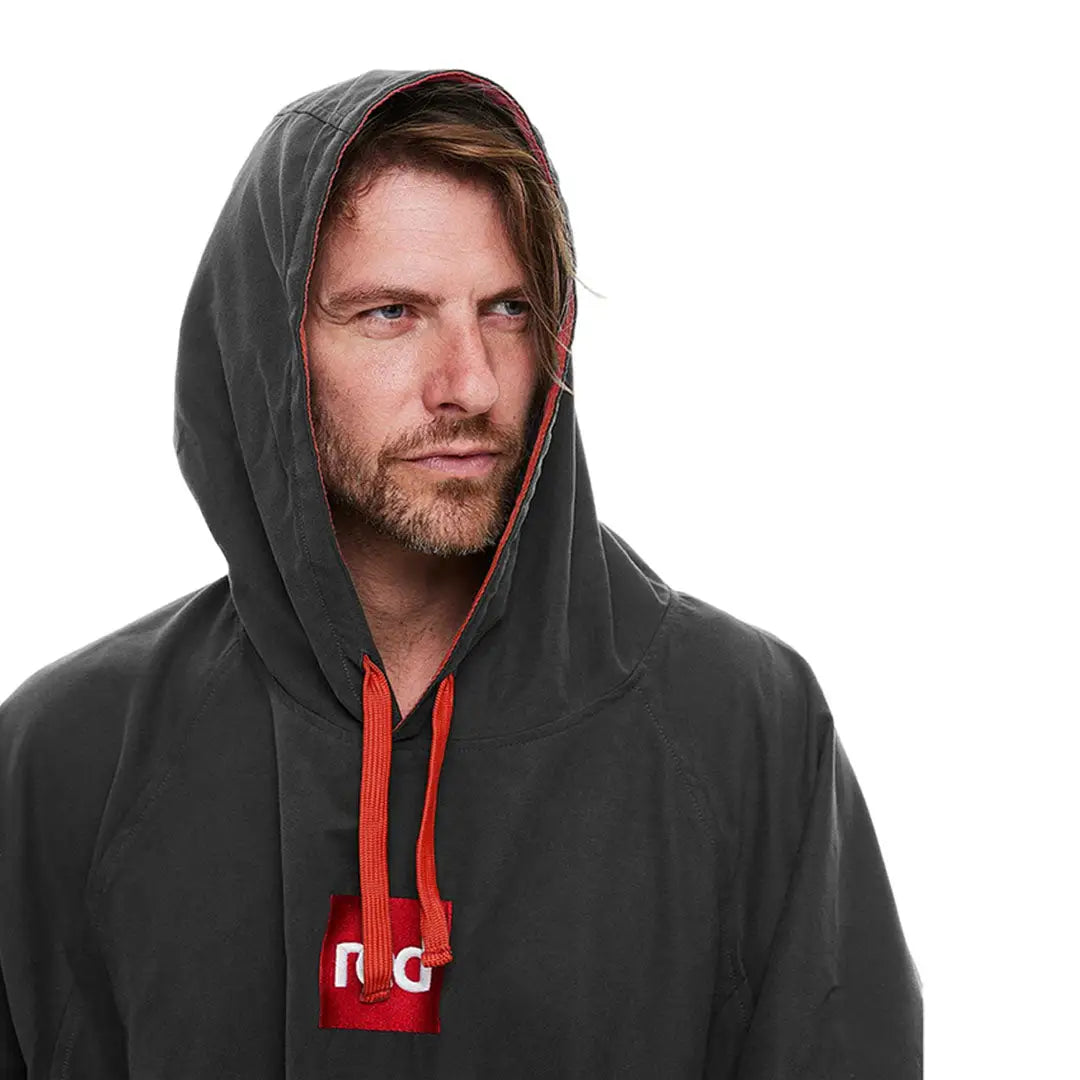 Man in dark gray hoodie with red accents, showcasing the Red Quick Dry Microfibre Changing Robe