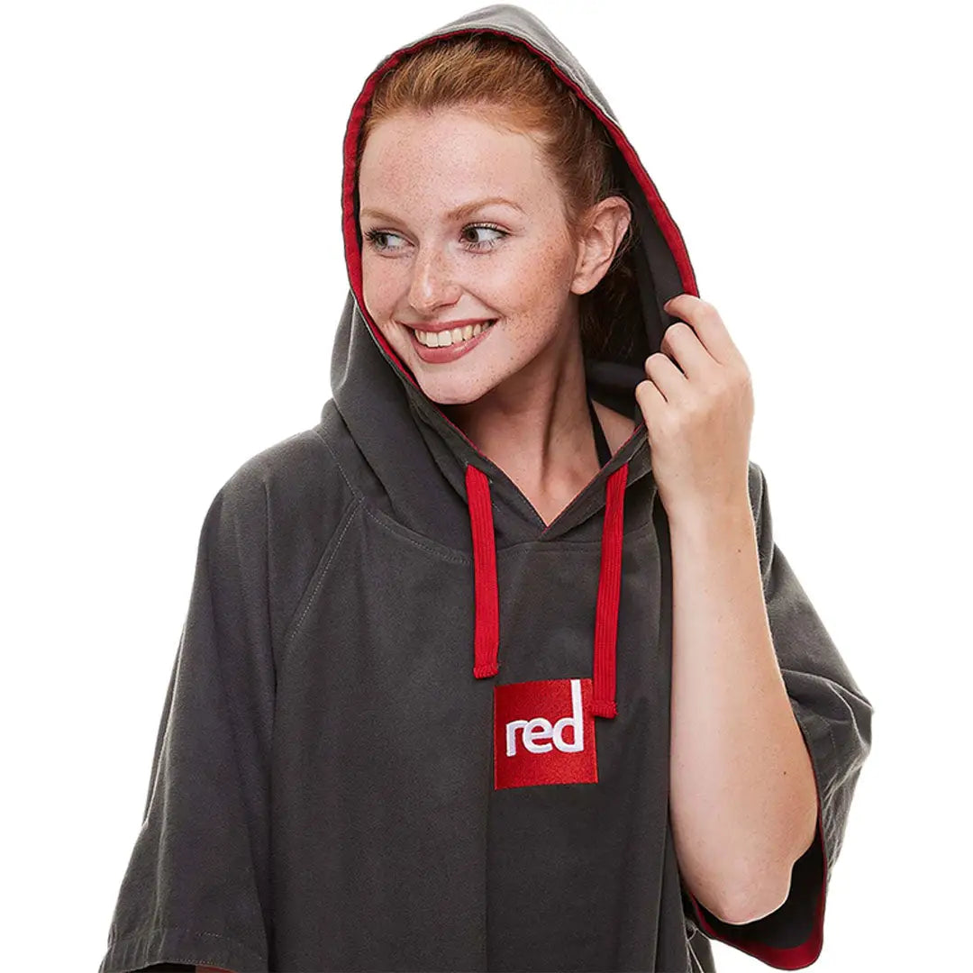 Gray microfibre changing robe with red accents and logo patch for quick drying